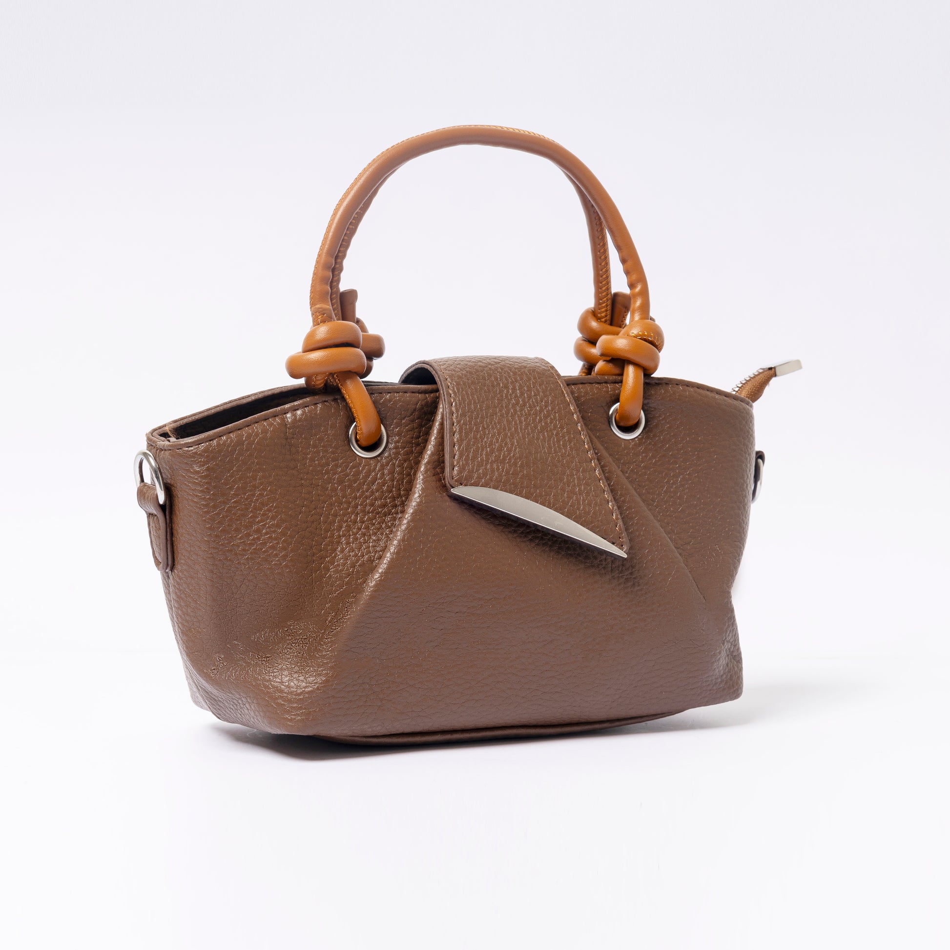 "Avérie Knot Bag Mocha Luxe signature knot handle close-up"
