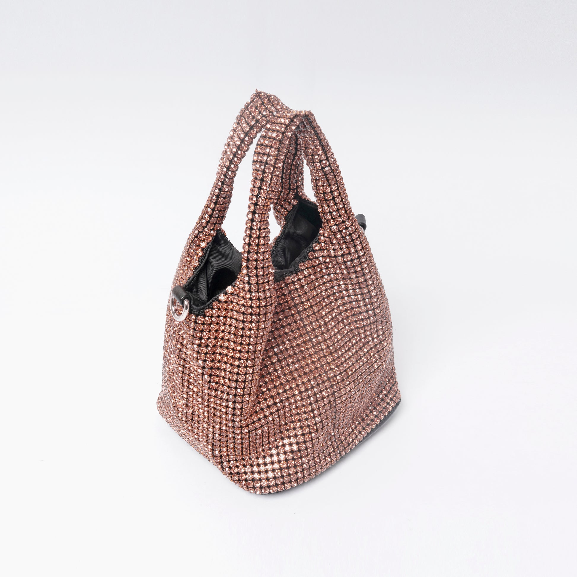 Celéste Crystal pink radiance rhinestone mesh detail close-up LUMINA evening clutch

