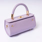 "Elùra Lilac Mist adjustable strap and gold hardware detail"
