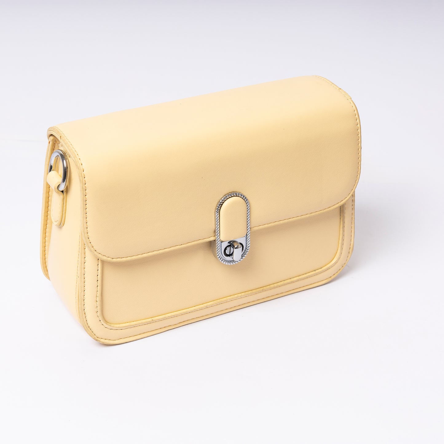 "Amélie Butter Cream adjustable strap and gold hardware detail"
