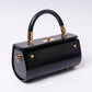 "Elùra Noir Luxe interior compartment and pockets black handbag with golden hardware"
