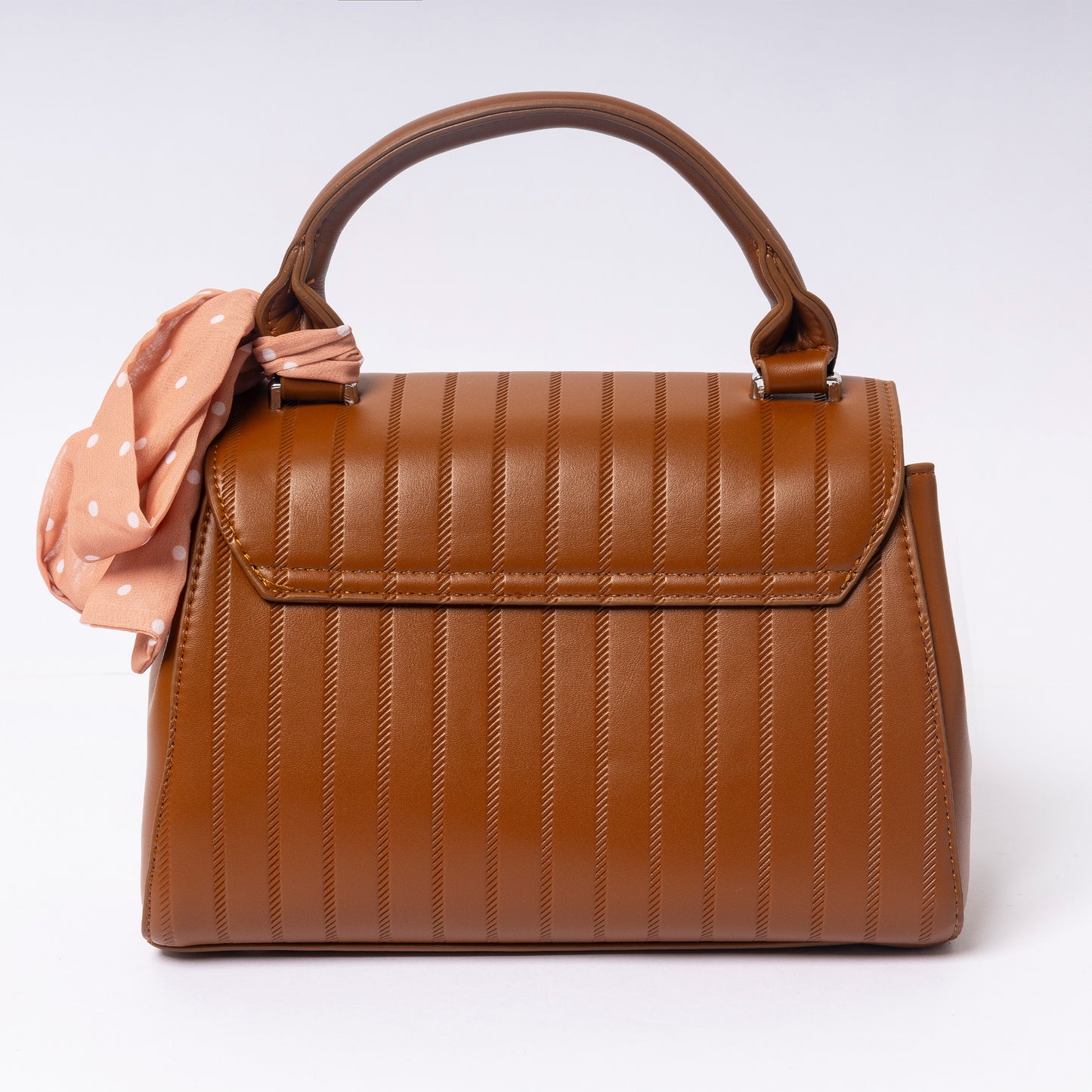 "Celína Cognac Charm adjustable strap and hardware detail"
