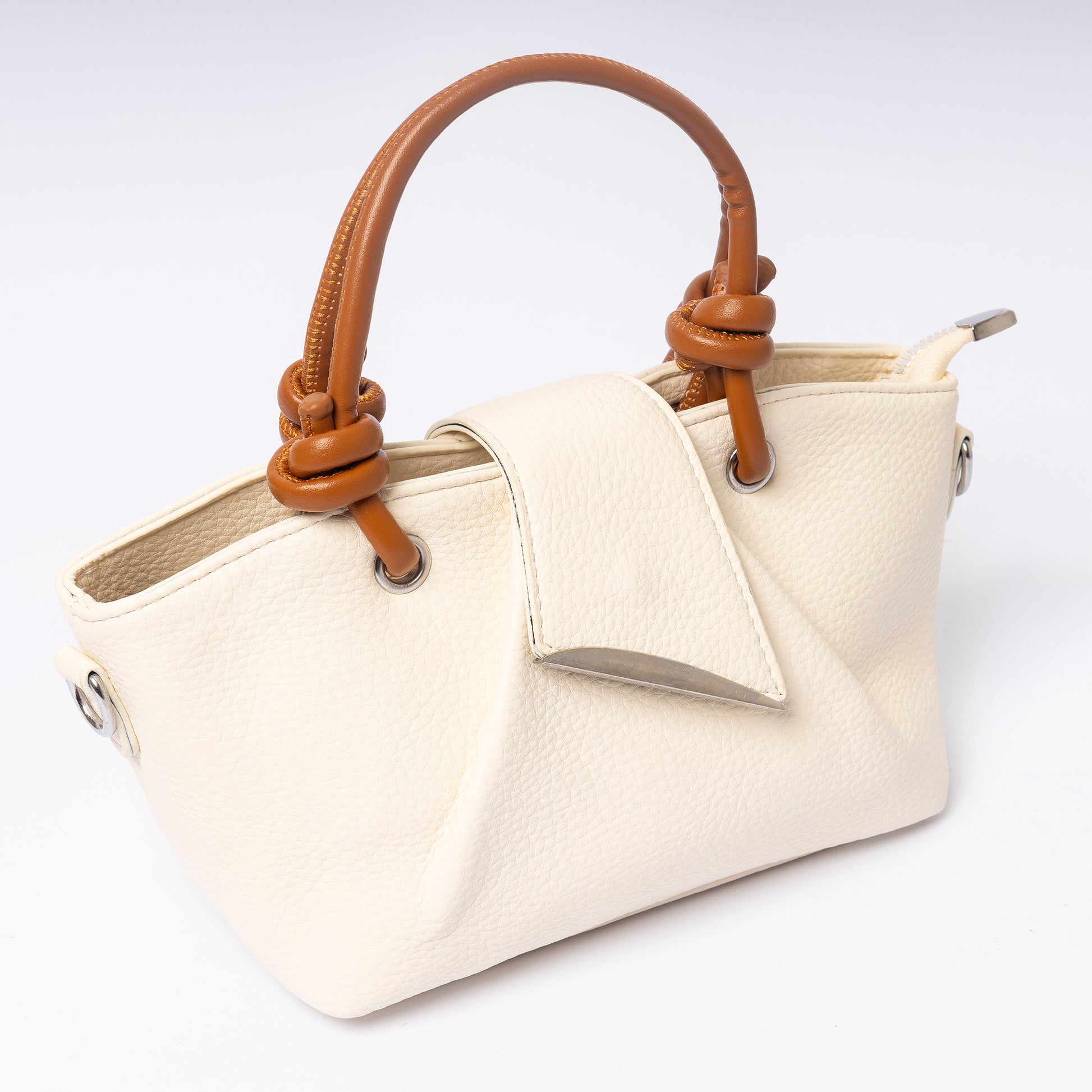 "Avérie Knot Bag Ivory Cream signature knot handle close-up"
