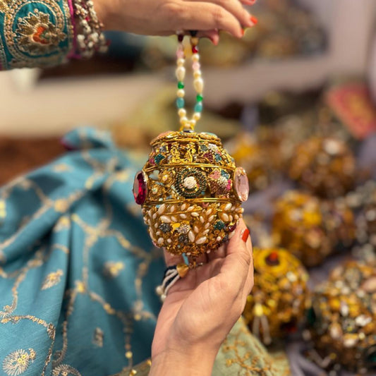 Heritage potli with multicolor gemstones pearls antique gold filigree LUMINA luxury clutch Pakistan

